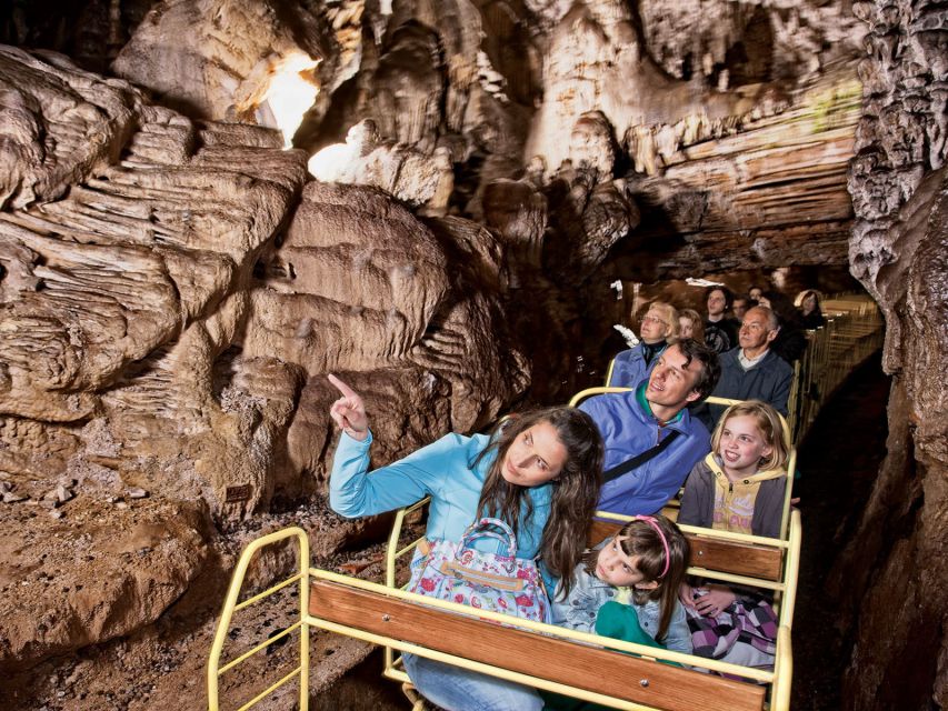 From Ljubljana: Postojna Cave & Predjama Castle Half-Day - Riding the electric train into Postojna Cave
