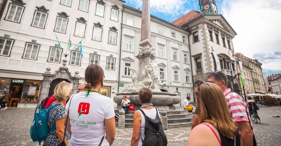 Ljubljana: Slovenian Cuisine Walking Tour with Tastings - Meeting at Triple Bridge and getting your bearings