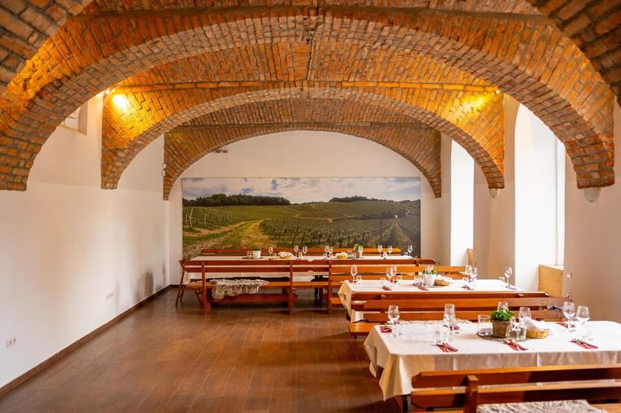 Maribor: Vinag Wine Cellar Tour with Wine tasting and snacks - Entering the Vinag cellar beneath Trg svobode